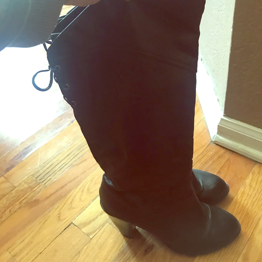 Black boots - with lace up ties in the back.